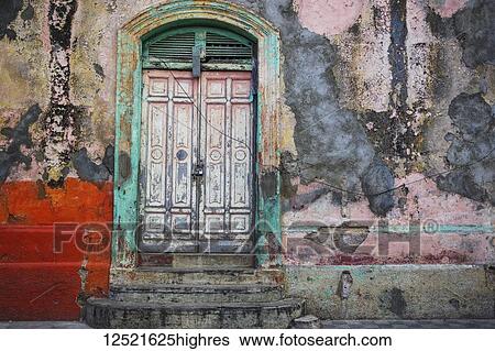Worn and weathered facade of a building with peeling paint and double doors; Nicaragua View Large Photo Image Stock Photograph - Worn and weathered facade of a building with peeling paint and double doors; Nicaragua. Fotosearch