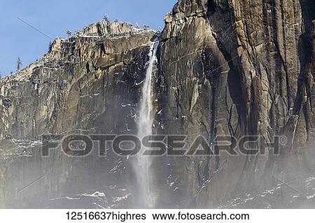 Stock Photograph - Yosemite Falls with a dusting of snow, Yosemite National Park; California, United States of America. Fotosearch