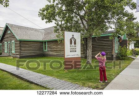 Young girl explores the Old Log Church Museum, Whitehorse, Yukon Territory, Canada, summer View Large Photo Image Picture - Young girl explores the Old Log Church Museum, Whitehorse, Yukon Territory, Canada, summer. Fotosearch