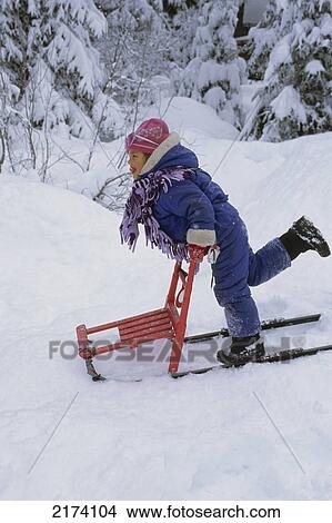 Young Girl Playing On Kicksled In Deep Snow Sc Ak Winter View Large Photo Image Picture - Young Girl Playing On Kicksled In Deep Snow Sc Ak Winter. Fotosearch