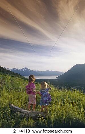 Stock Photo - Young Girls View Girdwood Valley & Turnagain Arm Sc/Nsummer Alaska. Fotosearch