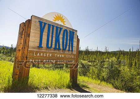 Stock Photo - Yukon Territory sign, Alaska Canada Boarder, Alaska, USA, Summer. Fotosearch