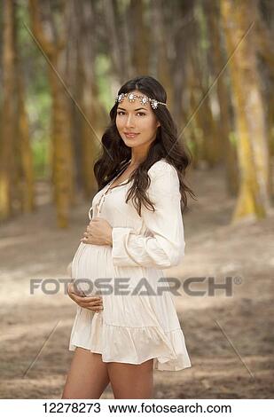 A pregnant woman walking in the woods; Hawaii, United States of America View Large Photo Image Stock Image - A pregnant woman walking in the woods; Hawaii, United States of America. Fotosearch
