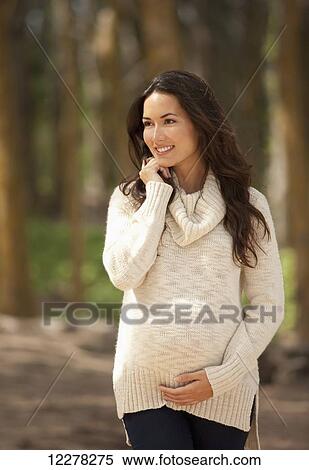 A pregnant woman walking in the woods; Hawaii, United States of America View Large Photo Image Stock Photography - A pregnant woman walking in the woods; Hawaii, United States of America. Fotosearch