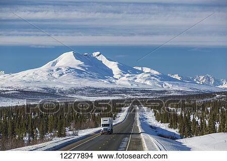 A Semi Truck drives down the Glenn Highway near Eureka, winter, Southcentral Alaska, USA View Large Photo Image Picture - A Semi Truck drives down the Glenn Highway near Eureka, winter, Southcentral Alaska, USA. Fotosearch