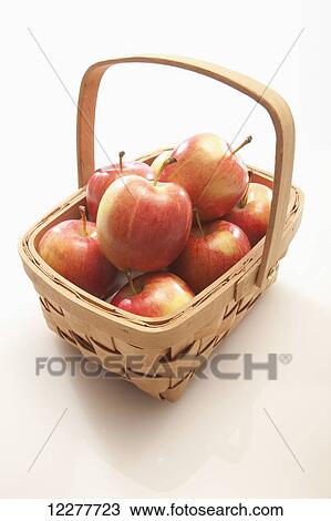 Stock Image - Apples in a basket; Edmonton, Alberta, Canada. Fotosearch