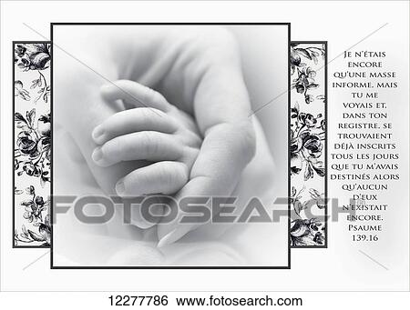 Stock Photograph - Artwork with french scripture and an image of a mother holding her newborn's little hand; Chilliwack, British Columbia, Canada. Fotosearch