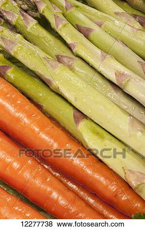 Stock Photo - Carrots and asparagus; Edmonton, Alberta, Canada. Fotosearch