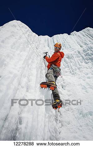 Stock Photo - Climbing an ice wall; Saint-Donat, Quebec, Canada. Fotosearch
