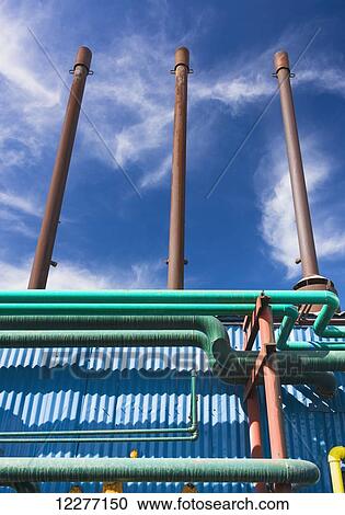 Electrical power plant piping with clouds and blue sky in the background, Prudhoe Bay, Arctic Alaska, USA, Summer View Large Photo Image Stock Image - Electrical power plant piping with clouds and blue sky in the background, Prudhoe Bay, Arctic Alaska, USA, Summer. Fotosearch
