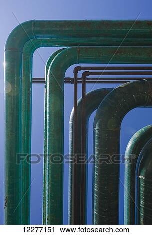 Electrical power plant piping with clouds and blue sky in the background, Prudhoe Bay, Arctic Alaska, USA, Summer View Large Photo Image Stock Image - Electrical power plant piping with clouds and blue sky in the background, Prudhoe Bay, Arctic Alaska, USA, Summer. Fotosearch