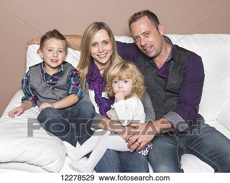 Stock Photo - Family portrait with young mother who is disabled; Spruce Grove, Alberta, Canada. Fotosearch