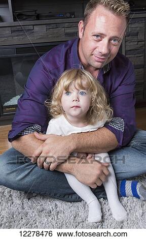 Father holding his toddler daughter; Spruce Grove, Alberta, Canada View Large Photo Image Stock Photograph - Father holding his toddler daughter; Spruce Grove, Alberta, Canada. Fotosearch