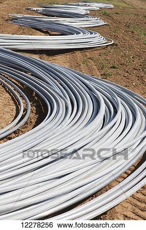 Stock Photograph - Frame for commercial greenhouses in early construction; Lancaster, Pennsylvania, United States of America. Fotosearch