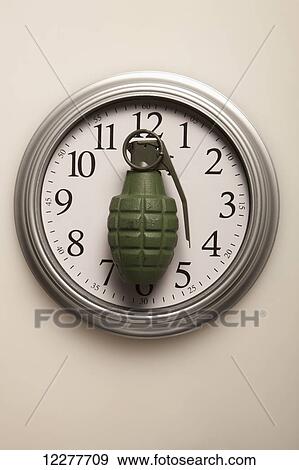 Stock Photo - Grenade on a clock; Edmonton, Alberta, Canada. Fotosearch