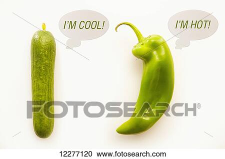 Stock Image - Hot pepper and cool cucumber; Edmonton, Alberta, Canada. Fotosearch