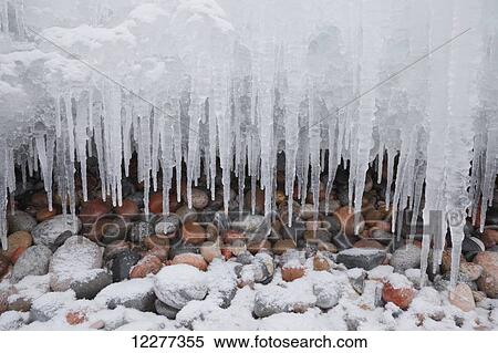 Icicles and snow over pebbles on the shore of Lake Superior View Large Photo Image Stock Photography - Icicles and snow over pebbles on the shore of Lake Superior. Fotosearch