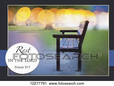 Stock Image - Lights out of focus on the beach walk with bench and Bible scripture; Penticton, British Columbia, Canada. Fotosearch