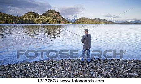 Man fishing on the shore of Grice Bay, Pacific National Park; Vancouver Island, British Columbia, Canada View Large Photo Image Stock Photo - Man fishing on the shore of Grice Bay, Pacific National Park; Vancouver Island, British Columbia, Canada. Fotosearch
