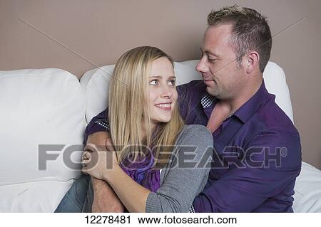 Married couple cuddling on the couch, wife has a spinal cord injury and is a paraplegic; Spruce Grove, Alberta, Canada View Large Photo Image Stock Image - Married couple cuddling on the couch, wife has a spinal cord injury and is a paraplegic; Spruce Grove, Alberta, Canada. Fotosearch