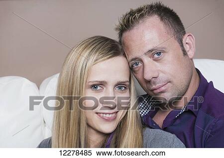 Married couple cuddling on the couch, wife has a spinal cord injury and is a paraplegic; Spruce Grove, Alberta, Canada View Large Photo Image Stock Photography - Married couple cuddling on the couch, wife has a spinal cord injury and is a paraplegic; Spruce Grove, Alberta, Canada. Fotosearch
