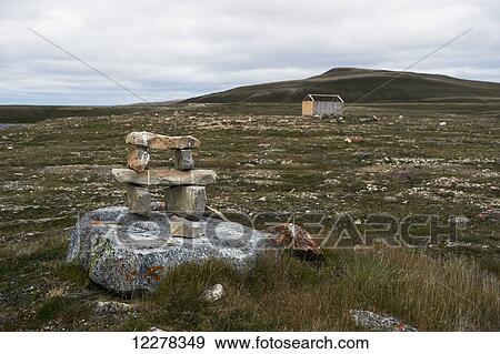 Mount Pelly and inukshuk on the tundra; Cambridge Bay, Nunavut, Canada View Large Photo Image Stock Photo - Mount Pelly and inukshuk on the tundra; Cambridge Bay, Nunavut, Canada. Fotosearch