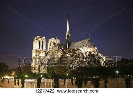Stock Image - Notre Dame cathedral at night; Paris, France. Fotosearch