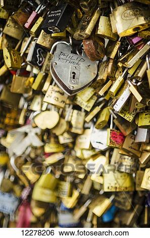 Padlocks with love messages line a bridge; Paris, France View Large Photo Image Stock Photograph - Padlocks with love messages line a bridge; Paris, France. Fotosearch