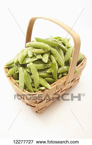 Stock Photo - Peas in a basket; Edmonton, Alberta, Canada. Fotosearch