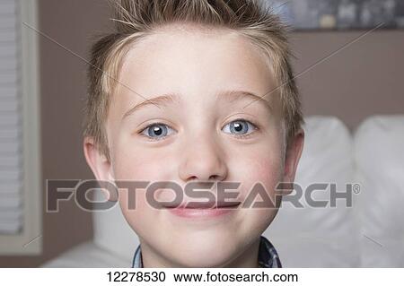 Stock Image - Portrait of a young boy; Spruce Grove, Alberta, Canada. Fotosearch