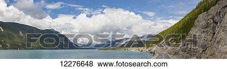 Stock Photo - Scenic panorama view of Muncho Lake, Muncho Lake Provincial Park, British Columbia, Canada, Summer. Fotosearch