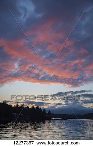 Scenic view of Inside Passage near Ketchikan at sunset, Southeast Alaska, summer View Large Photo Image Stock Photo - Scenic view of Inside Passage near Ketchikan at sunset, Southeast Alaska, summer. Fotosearch