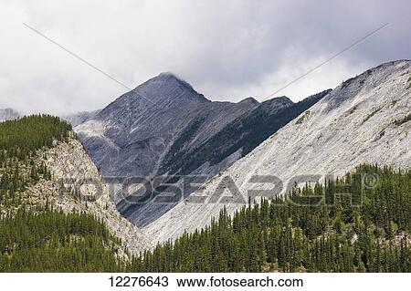 Stock Image - Scenic view of mountains in the area of Toad River, Muncho Lake Provincial Park, British Columbia, Canada, Summer. Fotosearch