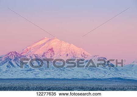 Stock Photography - Scenic view of Mt. Drum at sunset, Southcentral Alaska, Winter. Fotosearch