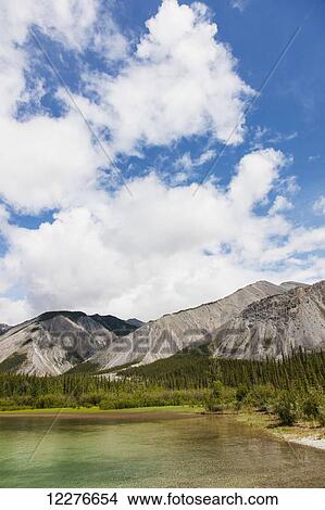 Scenic view of Muncho Lake, Muncho Lake Provincial Park, British Columbia, Canada, Summer View Large Photo Image Picture - Scenic view of Muncho Lake, Muncho Lake Provincial Park, British Columbia, Canada, Summer. Fotosearch