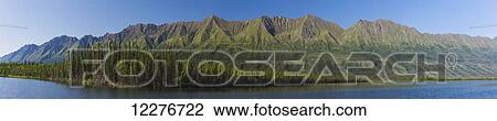 Stock Image - Scenic view of Pickhandle lake and mountains along the Alaska Highway, Yukon Territory, Canada, Summer. Fotosearch
