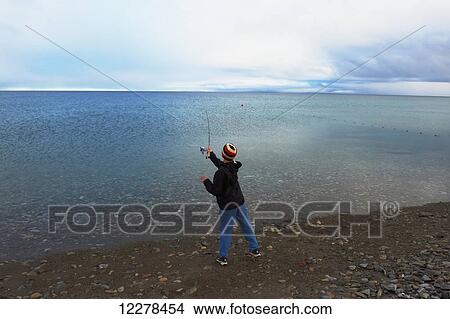 Shore fishing in the Arctic Ocean, Western Arm, near Cambridge Bay; Nunavut, Canada View Large Photo Image Picture - Shore fishing in the Arctic Ocean, Western Arm, near Cambridge Bay; Nunavut, Canada. Fotosearch