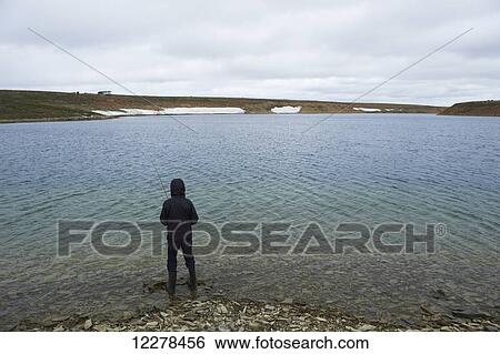 Stock Photograph - Shore fishing in the Arctic Ocean, Western Arm, near Cambridge Bay; Nunavut, Canada. Fotosearch