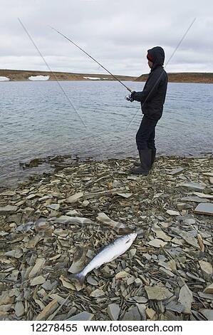 Stock Photography - Shore fishing in the Arctic Ocean, Western Arm, near Cambridge Bay; Nunavut, Canada. Fotosearch