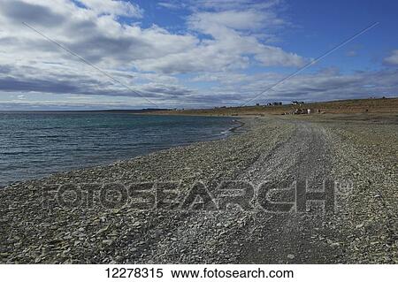 Shoreline along Cambridge bay, with buildings and tundra in the distance; Cambridge Bay, Nunavut, Canada View Large Photo Image Stock Photography - Shoreline along Cambridge bay, with buildings and tundra in the distance; Cambridge Bay, Nunavut, Canada. Fotosearch