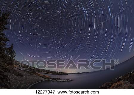 Star trail around the north star; Thunder Bay, Ontario, Canada View Large Photo Image Stock Photo - Star trail around the north star; Thunder Bay, Ontario, Canada. Fotosearch