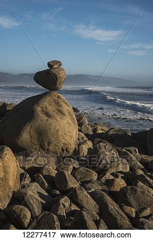 Stock Photo - Stones balanced on Neahkahnie Beach; Manzanita, Oregon, United States of America. Fotosearch