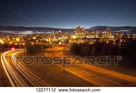 Street lights and light trails of headlights illuminating a street; Edmonton, Alberta, Canada View Large Photo Image Stock Image - Street lights and light trails of headlights illuminating a street; Edmonton, Alberta, Canada. Fotosearch
