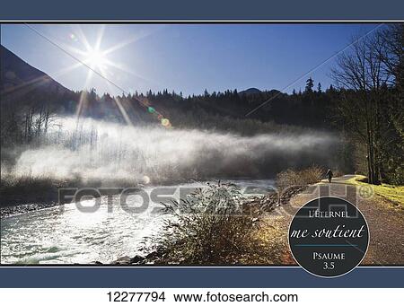 Sun rising over the Chilliwack River and French scripture; Chilliwack, British Columbia, Canada View Large Photo Image Picture - Sun rising over the Chilliwack River and French scripture; Chilliwack, British Columbia, Canada. Fotosearch