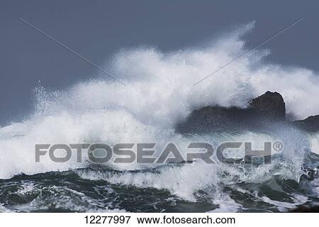 Stock Photo - Surf breaks on the rocks at Yaquina Head; Newport, Oregon, United States of America. Fotosearch