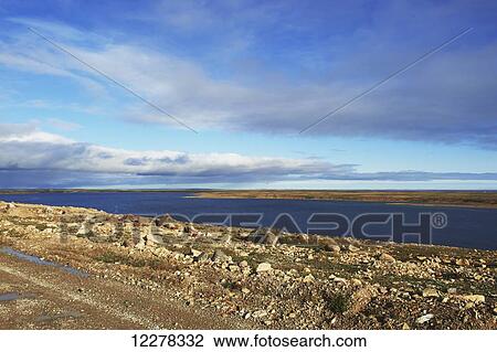 Stock Image - Tundra and the Arctic Ocean; Cambridge Bay, Nunavut, Canada. Fotosearch