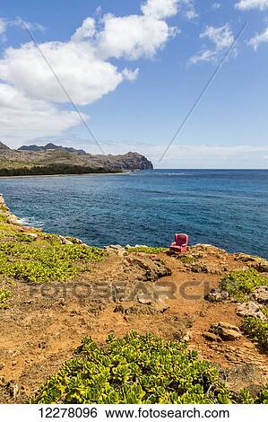 View of a red stuffed arm chair placed on a cliff edge; Poipu, Kauai, Hawaii, United States of America View Large Photo Image Stock Photograph - View of a red stuffed arm chair placed on a cliff edge; Poipu, Kauai, Hawaii, United States of America. Fotosearch