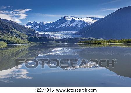 Stock Photography - View of the Mendenhall Glacier reflected in Mendenhall Lake near Juneau, Southeast Alaska, Summer. Fotosearch