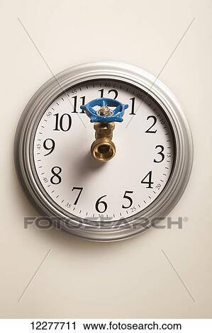 Stock Image - Water tap on a clock; Edmonton, Alberta, Canada. Fotosearch