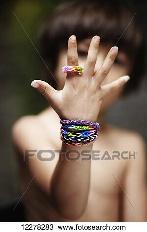 Young boy wearing homemade bracelets View Large Photo Image Stock Image - Young boy wearing homemade bracelets . Fotosearch